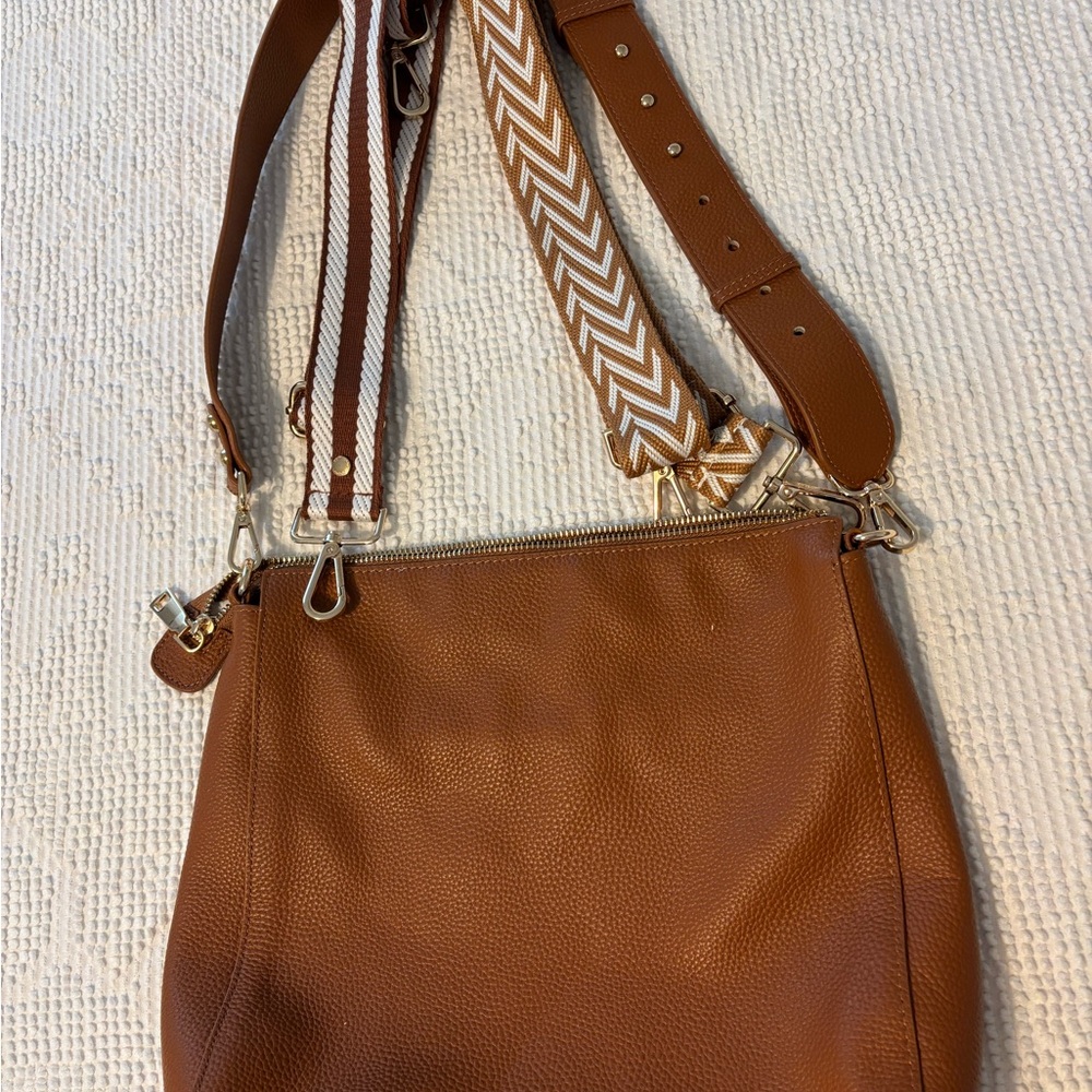 Elegant Tan Crossbody Bag with Patterned Strap